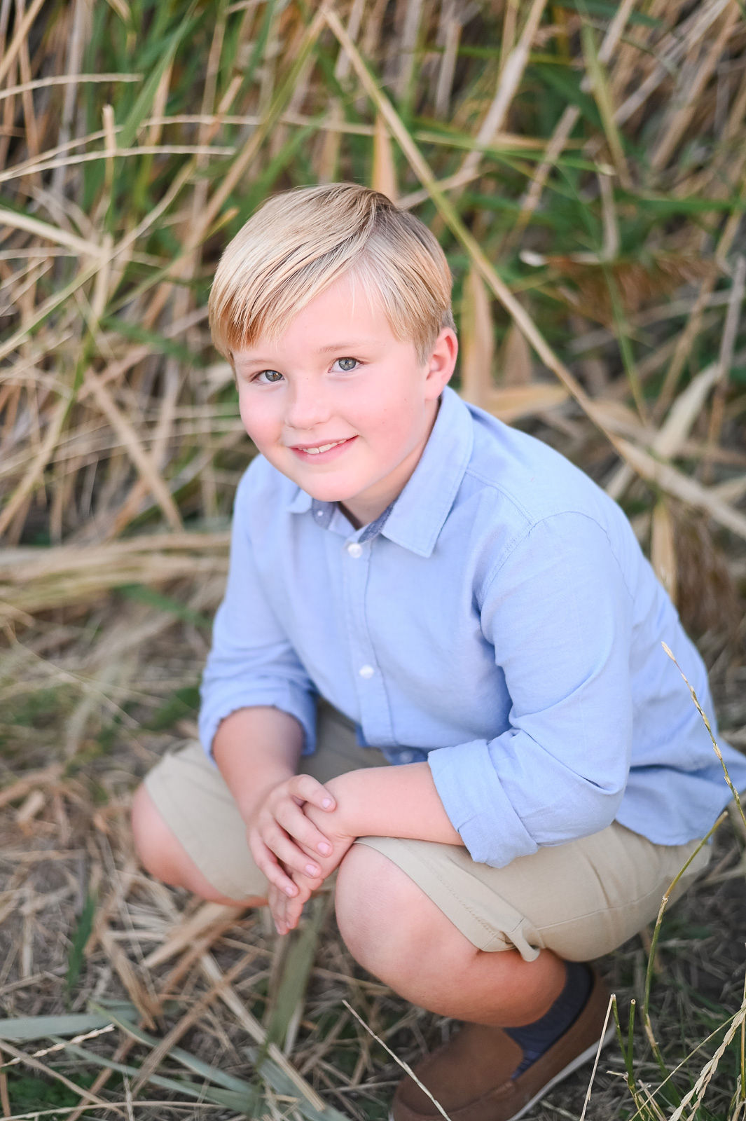 Little boy smiling on at golden hour in Tunnel Springs Park.