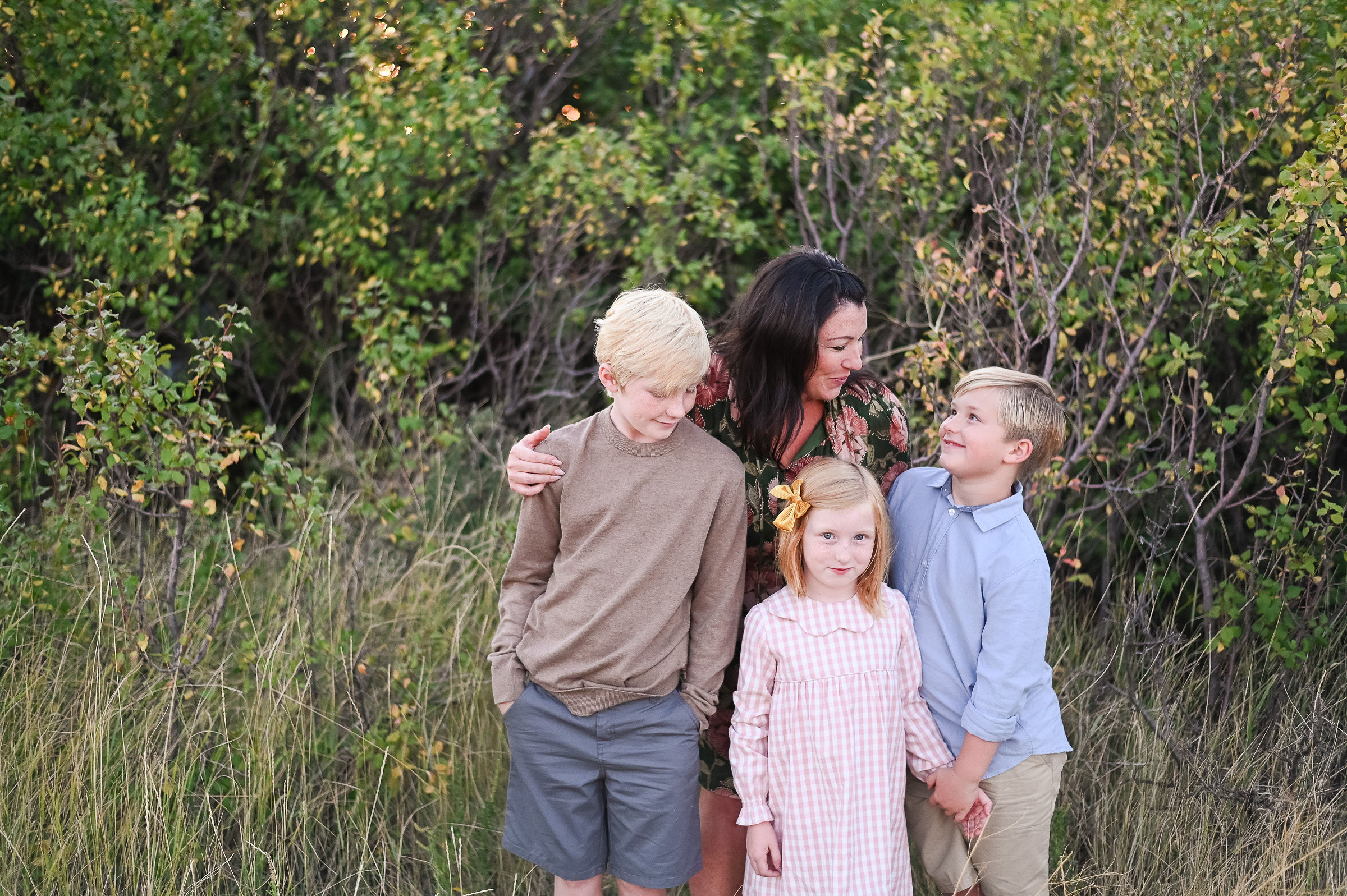 Family talking with each other at Tunnel Springs Park in Utah.