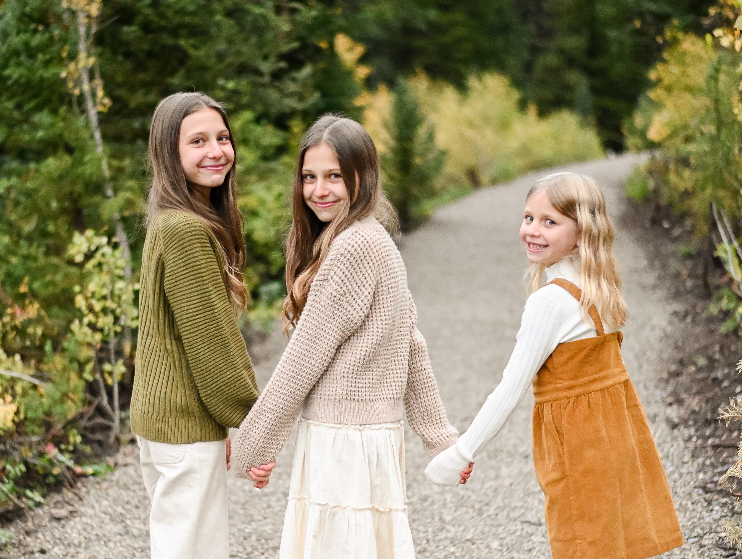 Sisters walking on the trails in the fall of Big Cottonwood Canyon in Utah. Fall family photos in Cottonwood Canyon