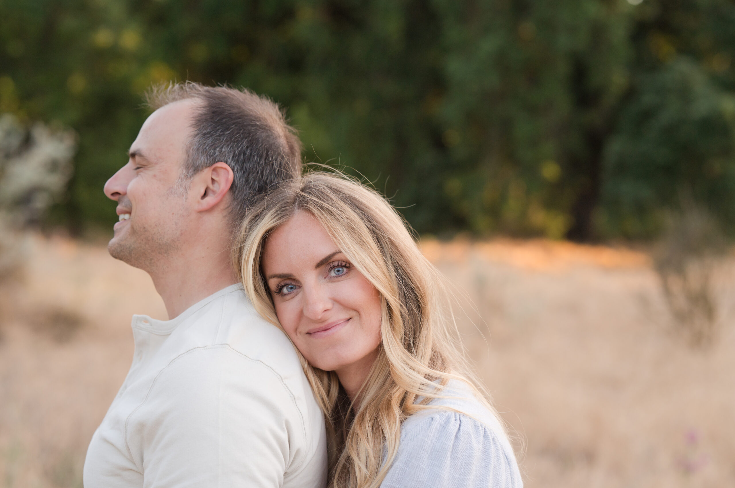 Moms blue eyes are the star of the show in this beautiful couple photo as Hubby smiles.