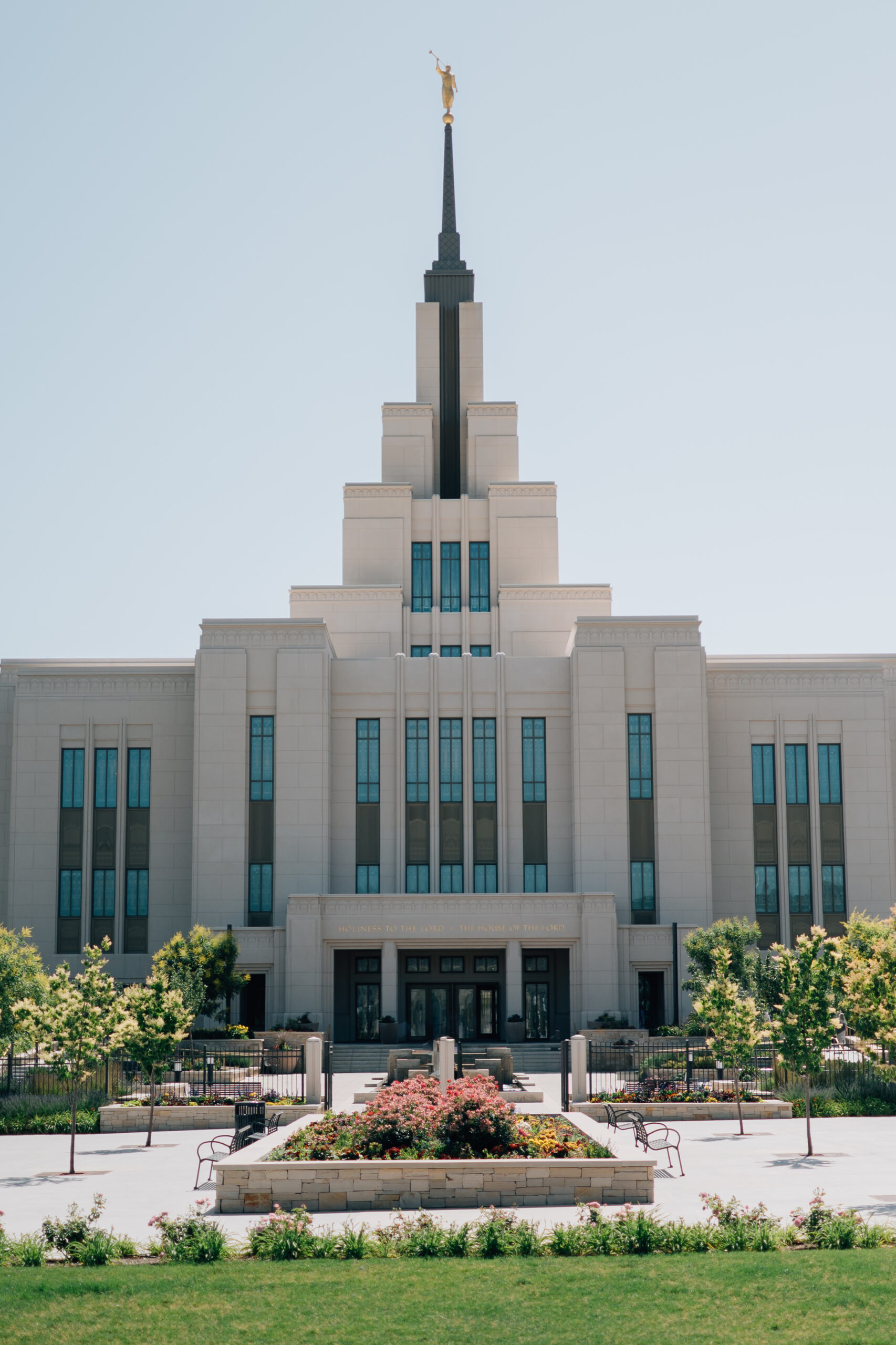 The LDS Saratoga Springs Temple shines brightly in the midday sun showing off the beautiful blue stained glass windows.