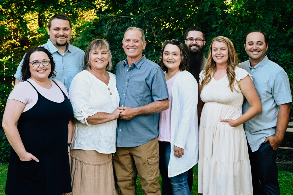 Grandma & Grandpa with their kids and spouses posing for the camera