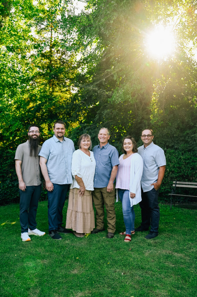 Grandma & Grandpa with their original kids posing for a family picture