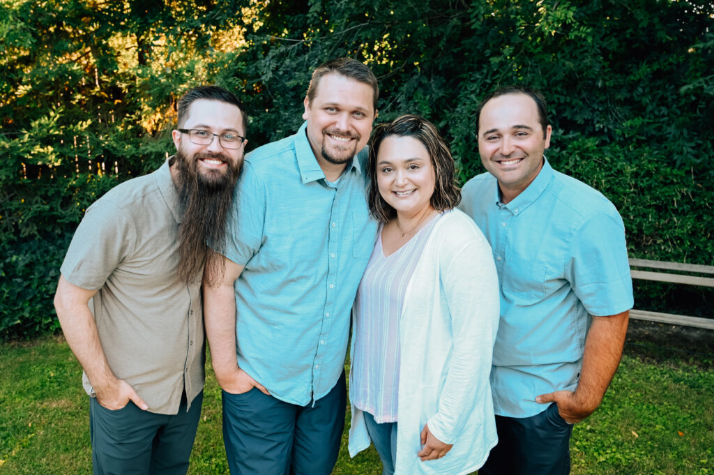 The original four siblings smiling on