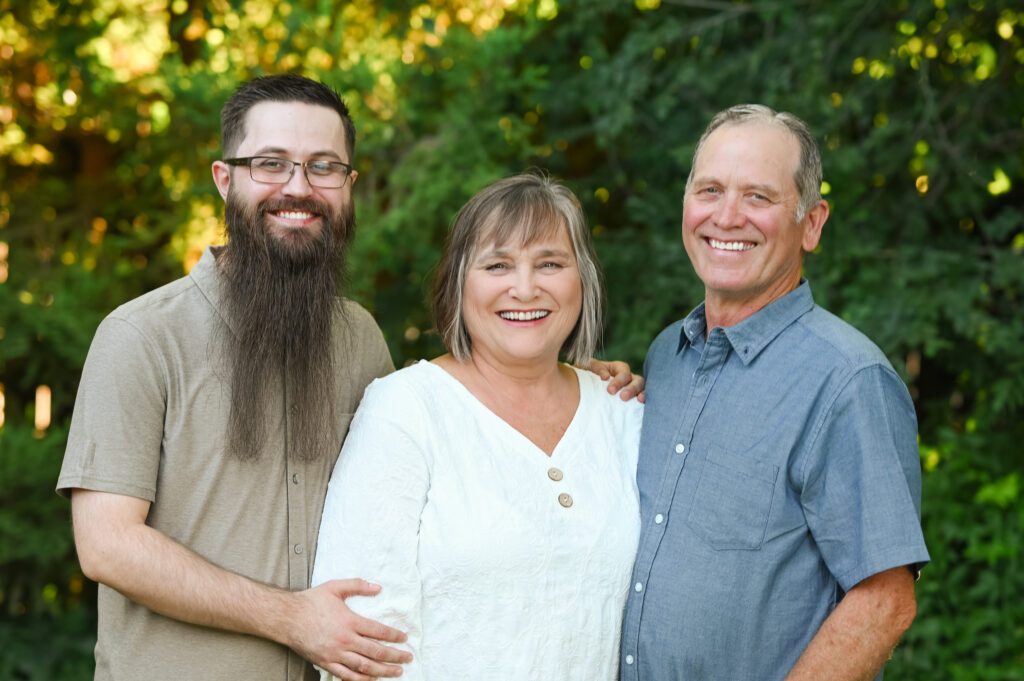 Mom and Dad laughing with their son.