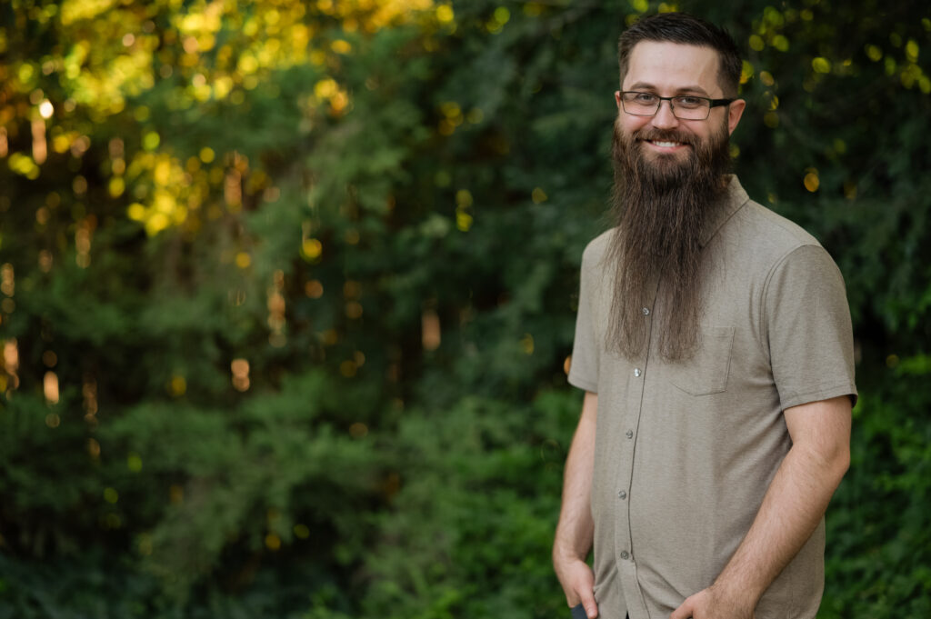 A son smiles big for his new profile shot.