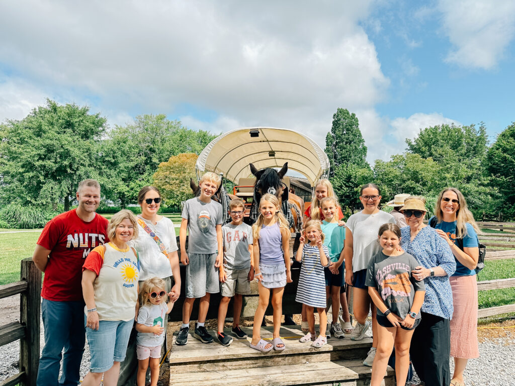 An extended family photo opportunity in front of a horse and buggy in Nauvoo, IL.