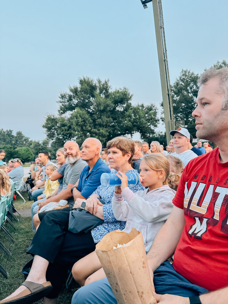 A family looks on to the Nauvoo pageant. 