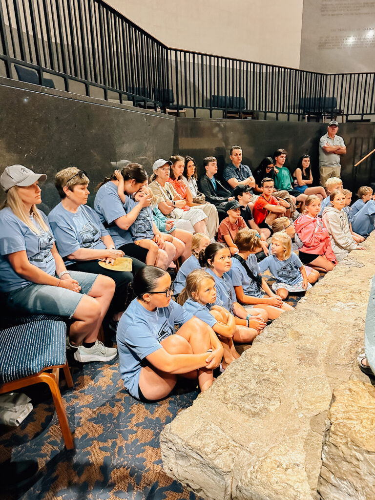 A group of people learning more about Liberty Jail in Missouri