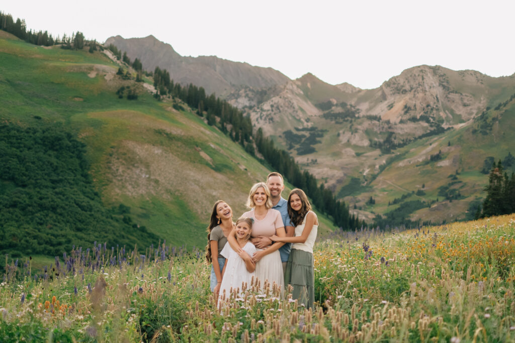 A joyful family portrait captured in Little Cottonwood Canyon at golden hour.