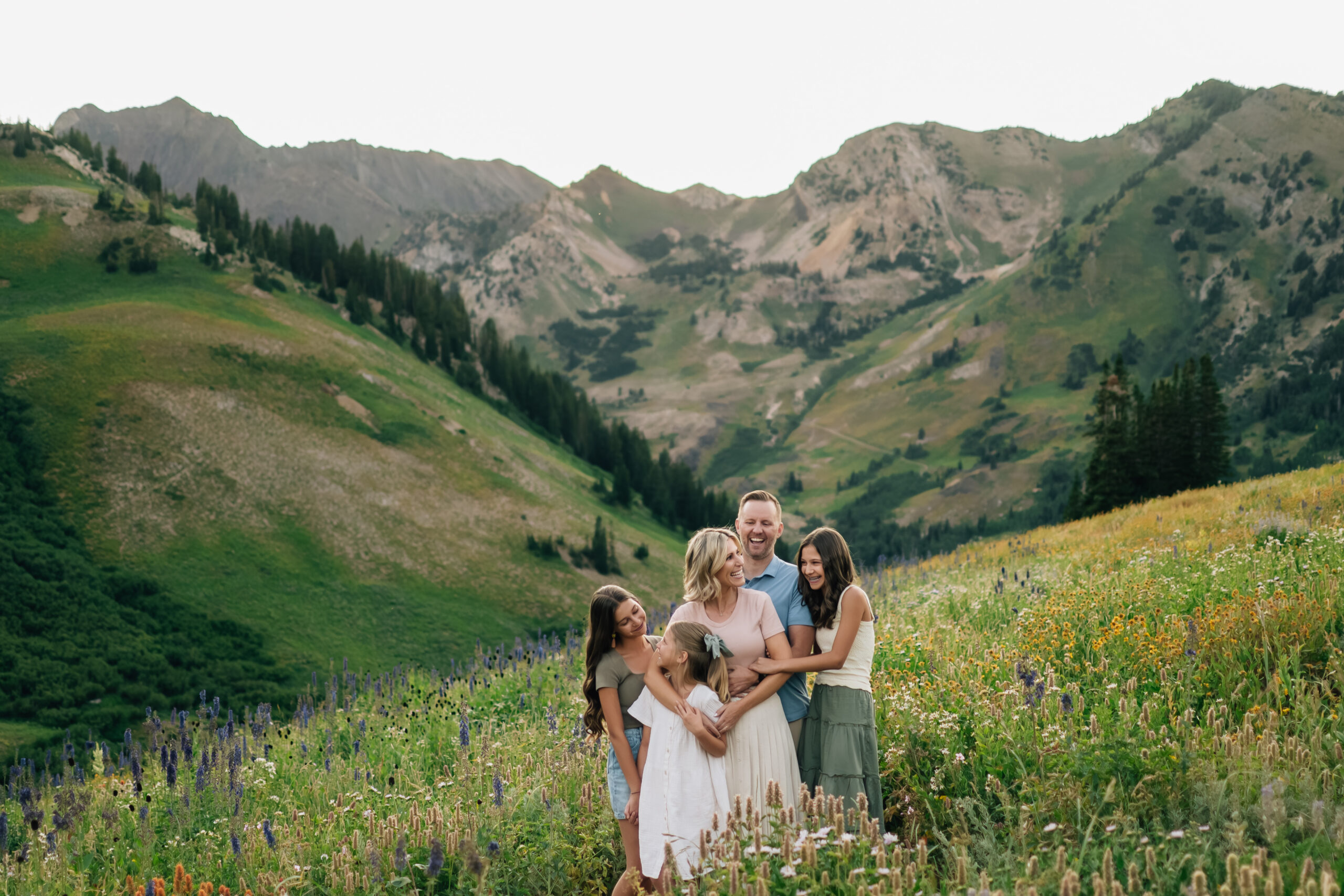A joyful family portrait captured in Little Cottonwood Canyon at golden hour.