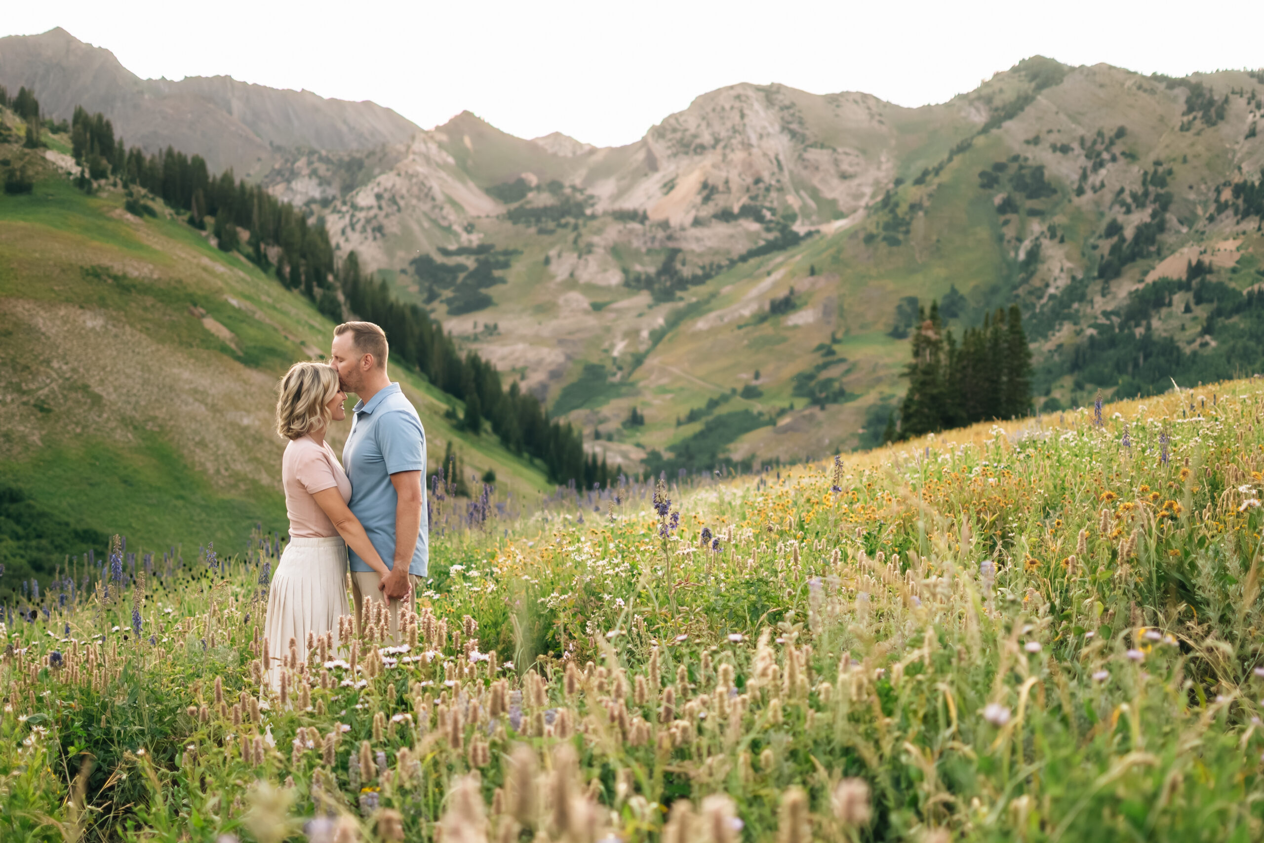 Dad kisses Mom's forehead during a Family Session in Little Cottonwood Canyon, UT 