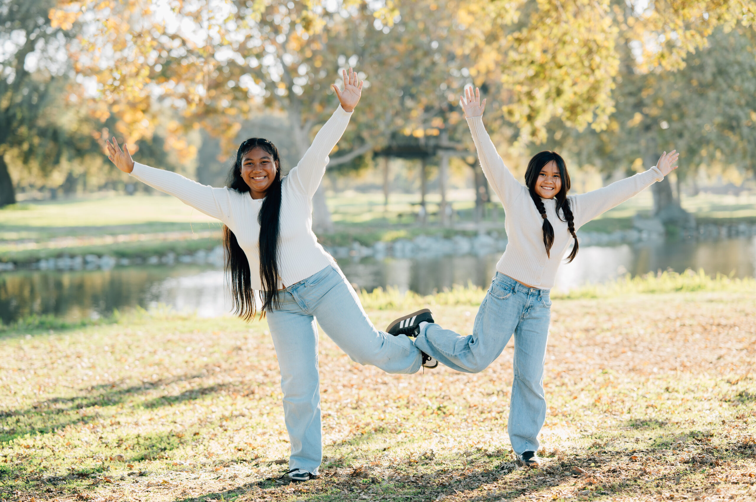 Children jumping and laughing during an extended family photo session in North Stockton