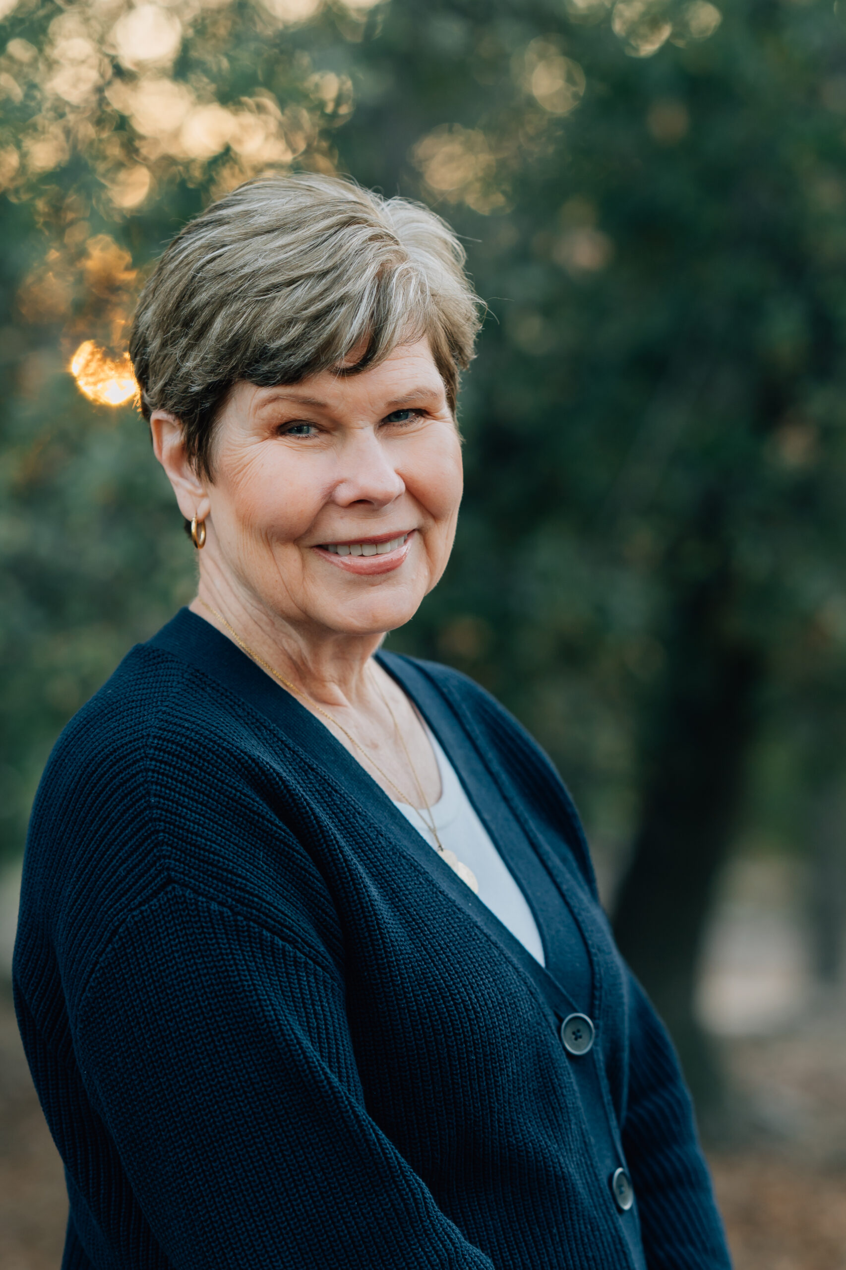 Grandparents standing together surrounded by nature during a legacy photography session