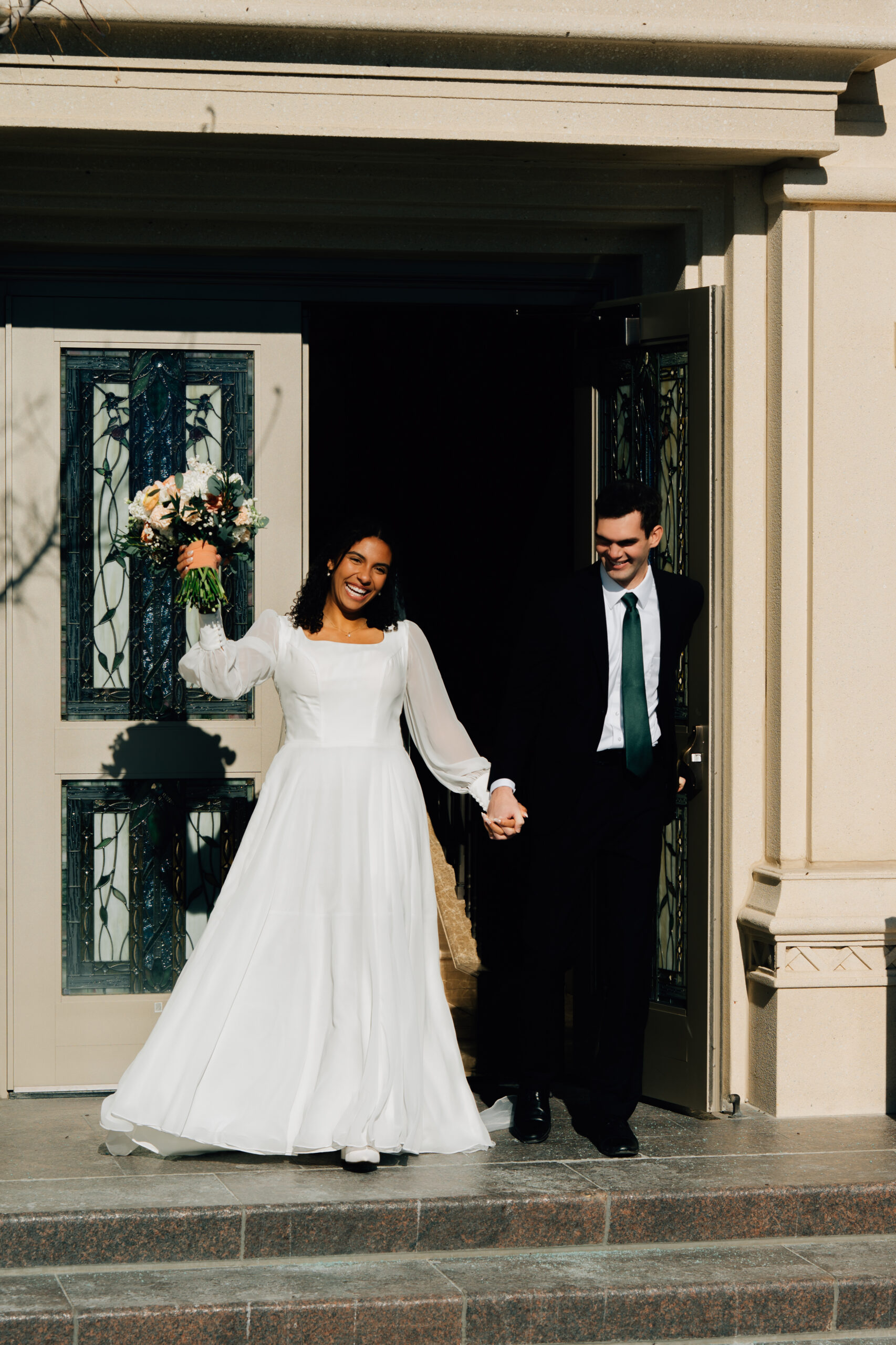Bride and groom outside the Payson LDS Temple after their wedding ceremony