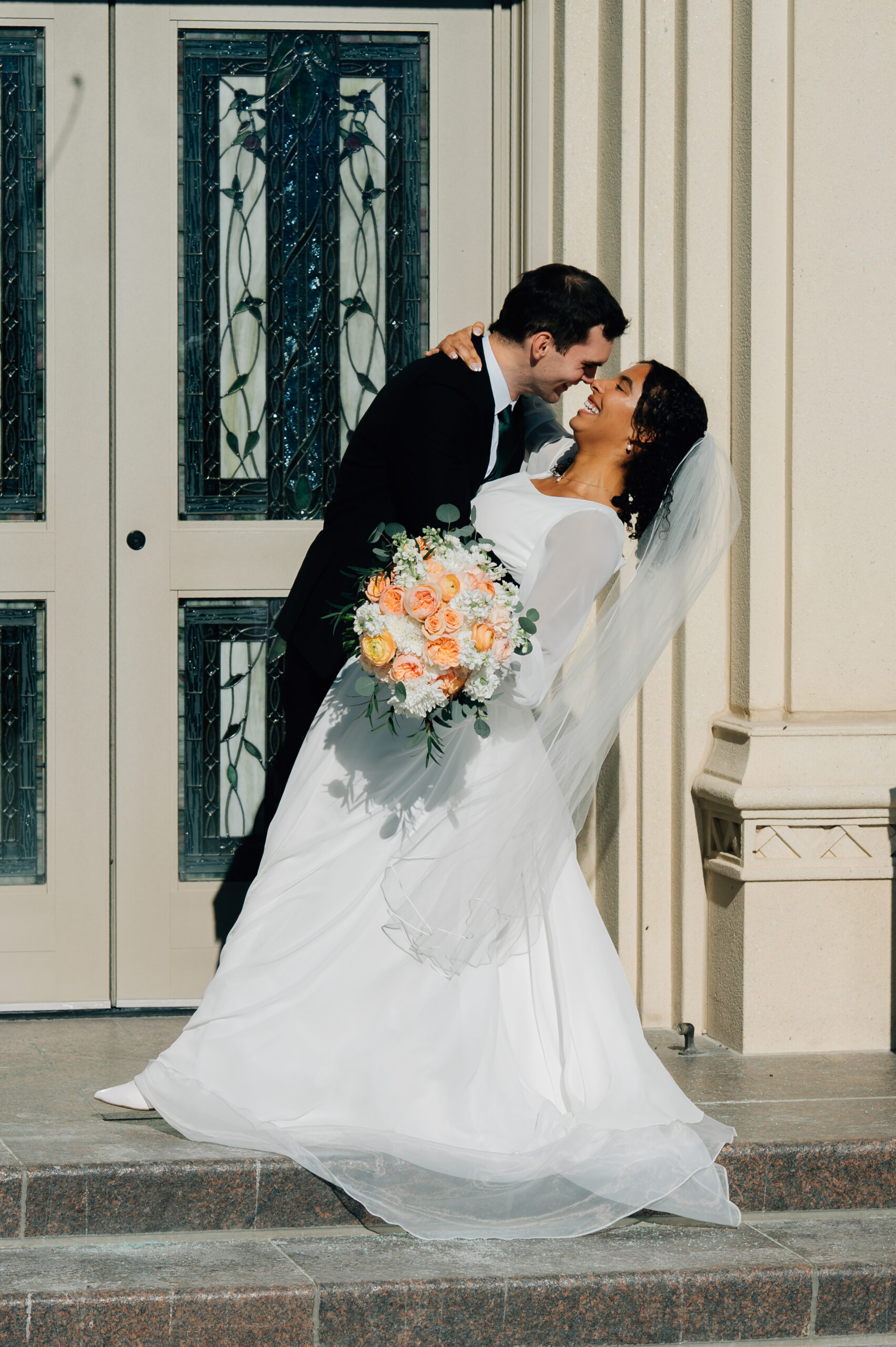 Bride and groom outside the Payson LDS Temple after their wedding ceremony