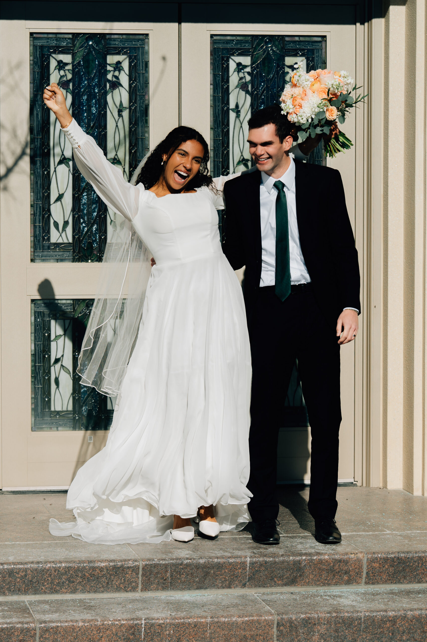 Bride and groom outside the Payson LDS Temple after their wedding ceremony
