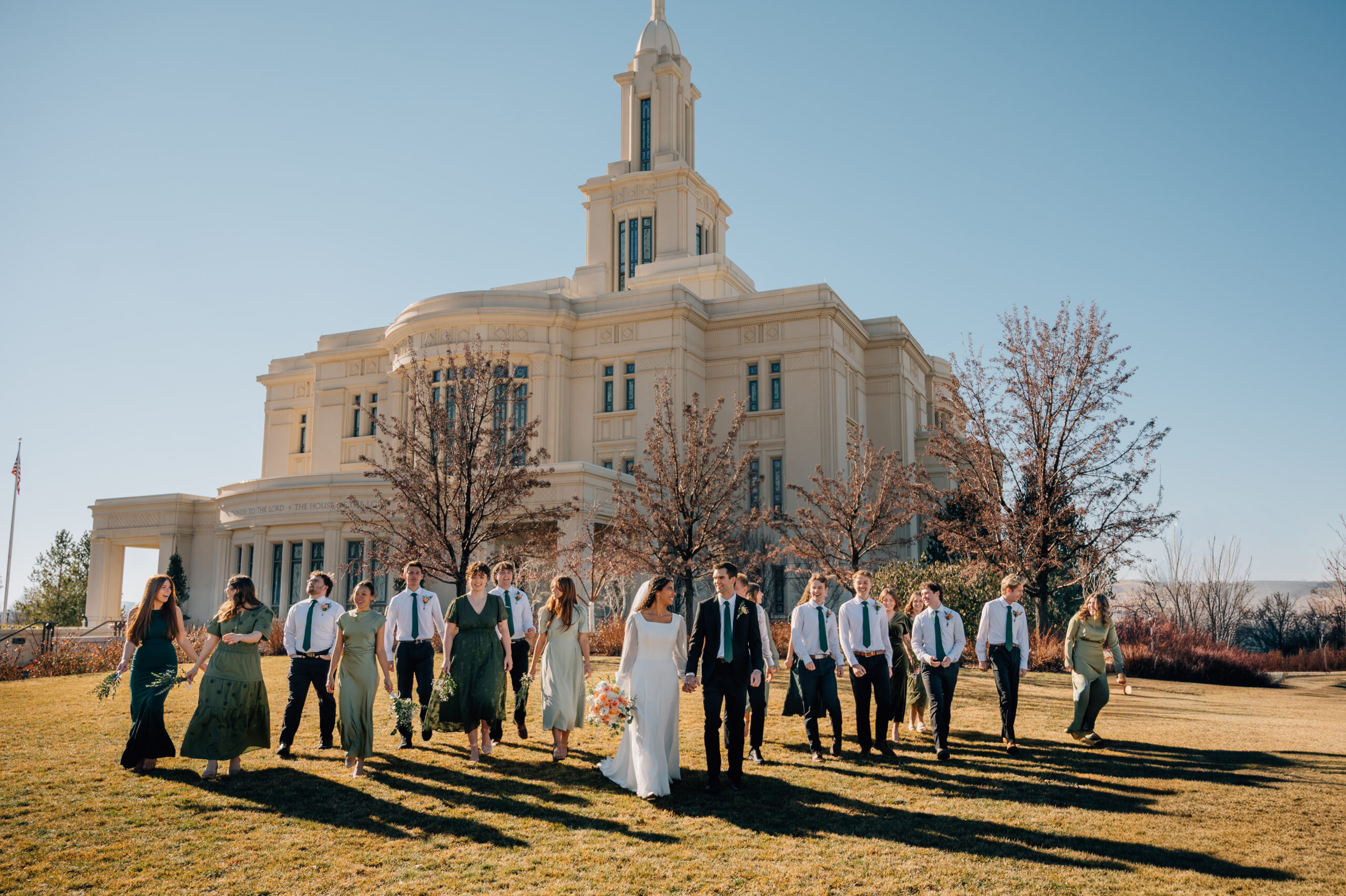 Bridal party walking together outside the Payson Utah Temple