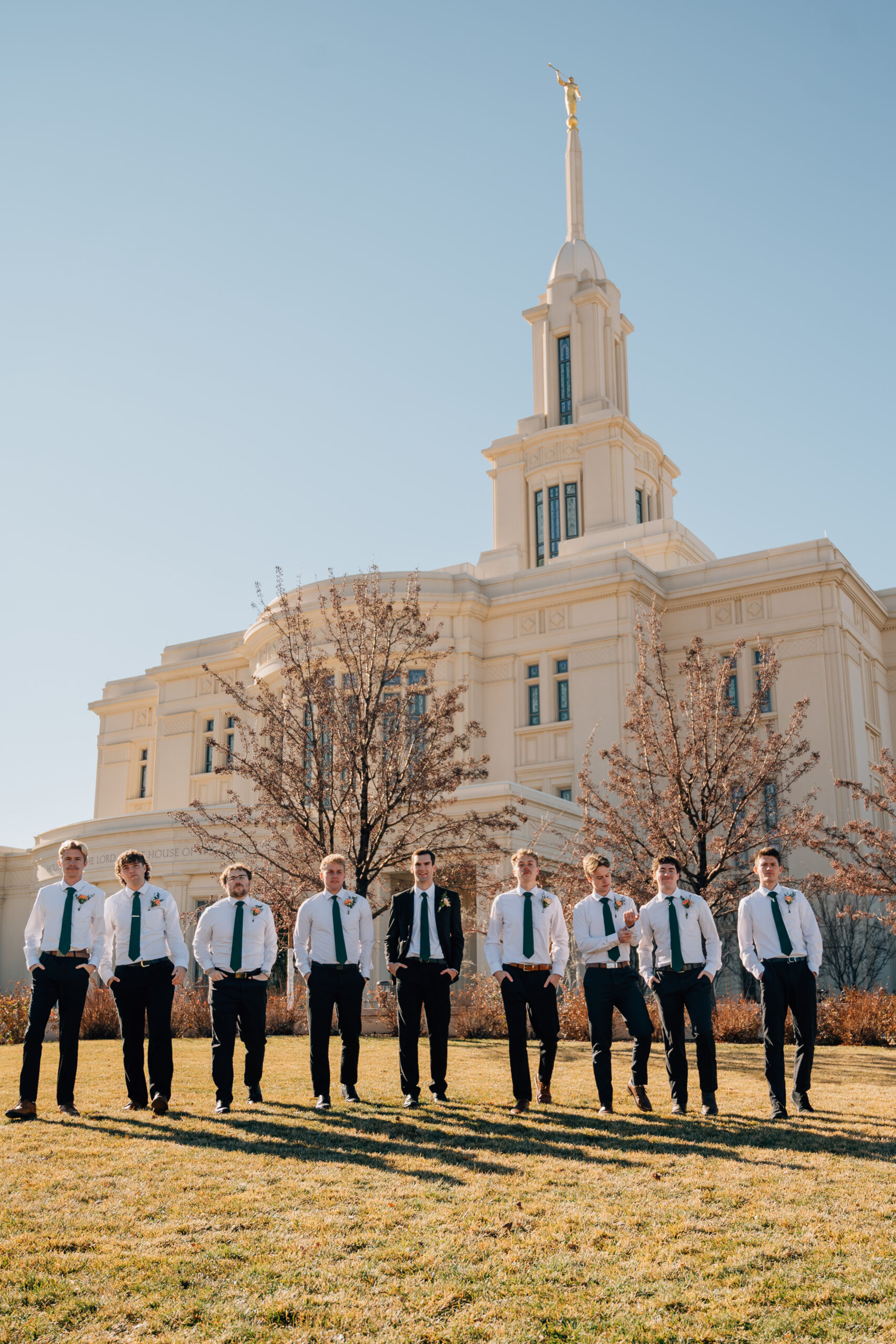 Groomsmen walking together outside the Payson Utah Temple