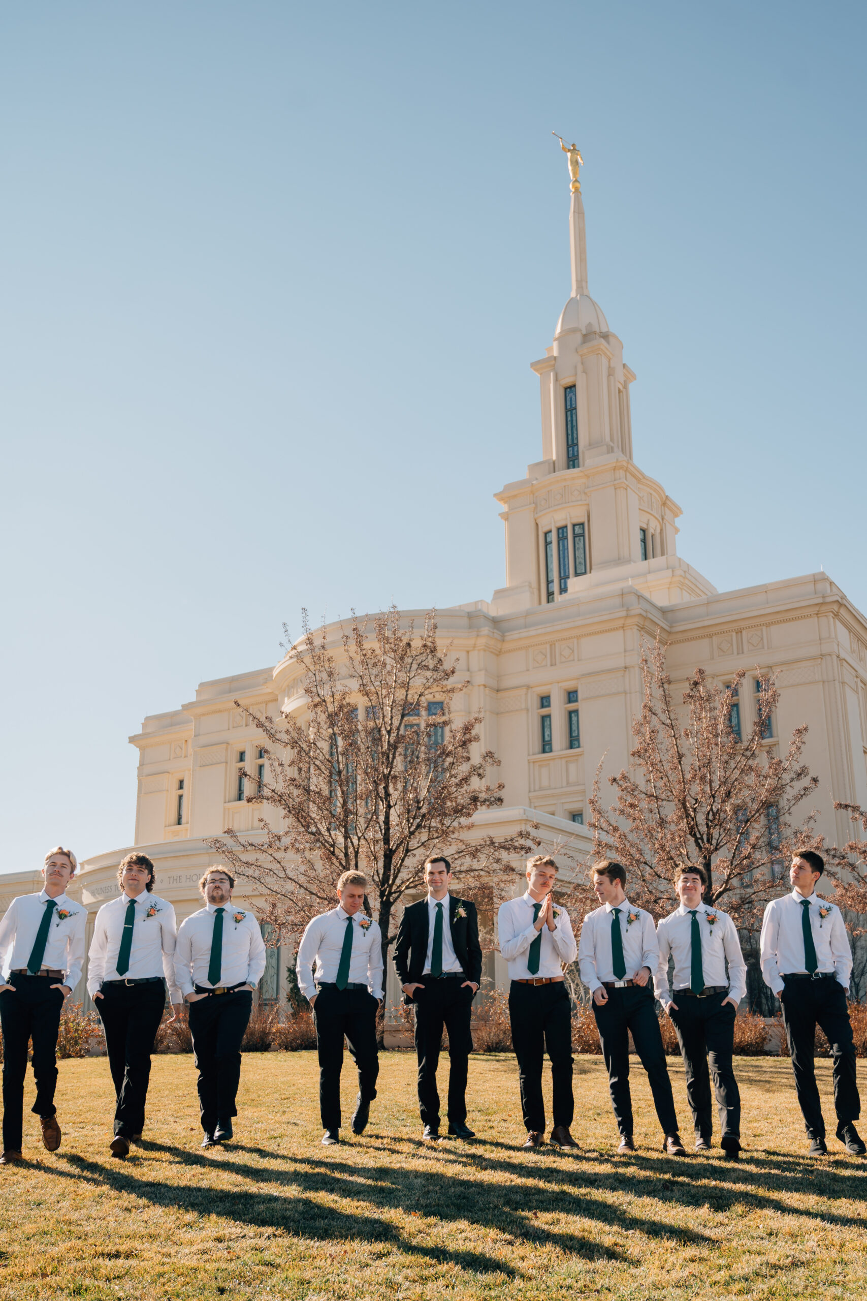 Groomsmen walking together outside the Payson Utah Temple