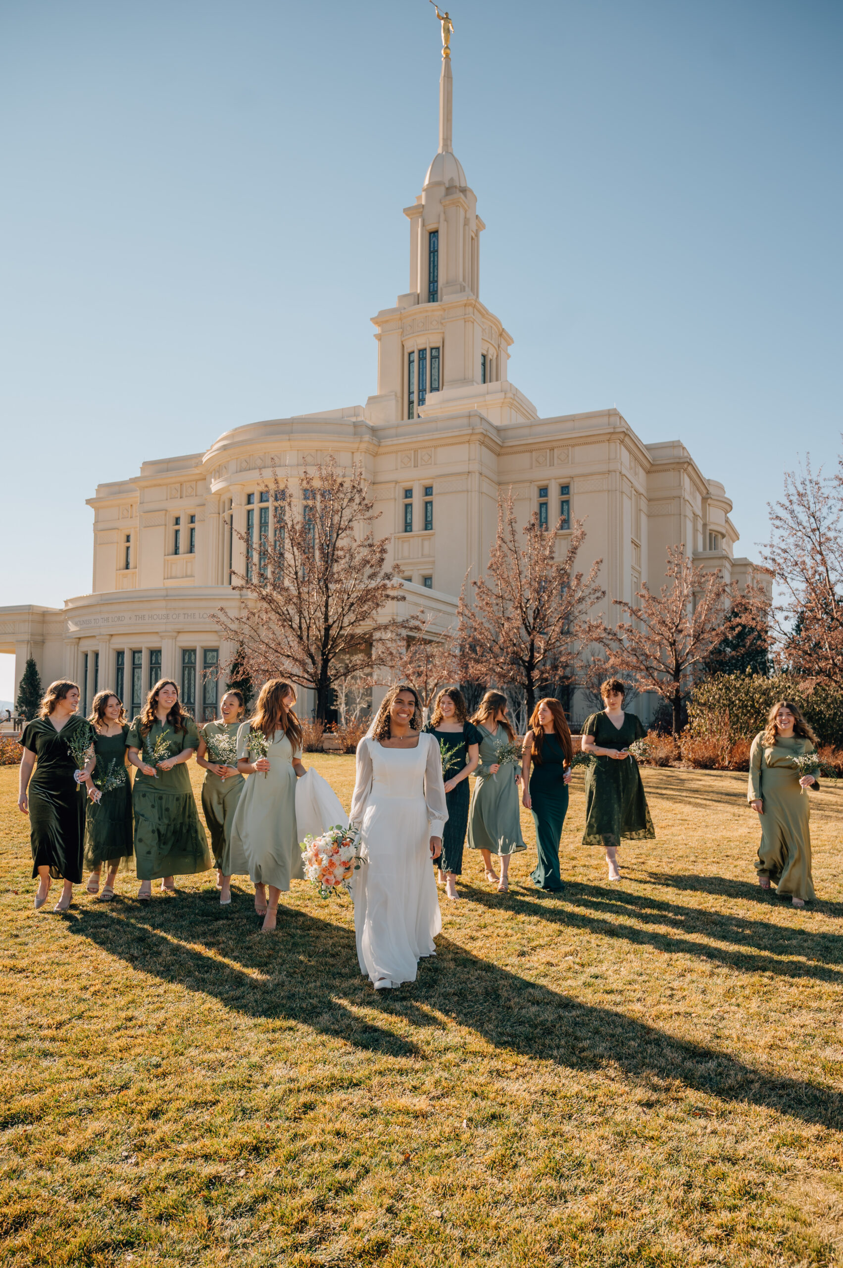 Bridesmaids walking together outside the Payson Utah Temple