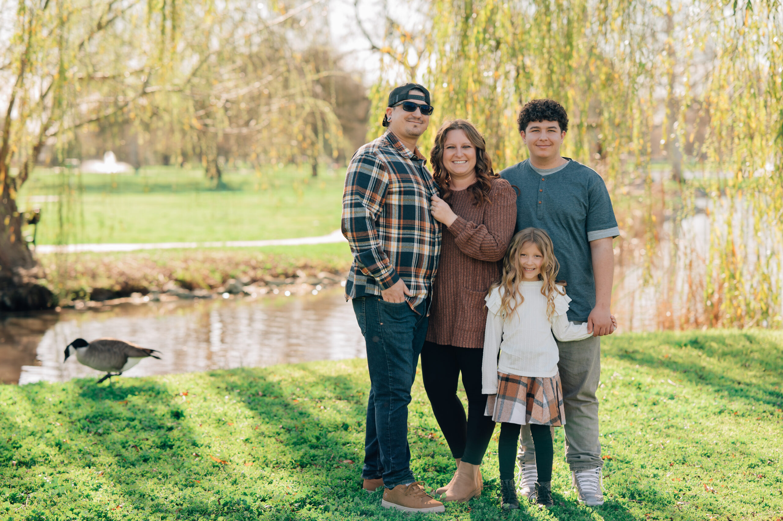 family portrait under willow tree at shumway oak grove park