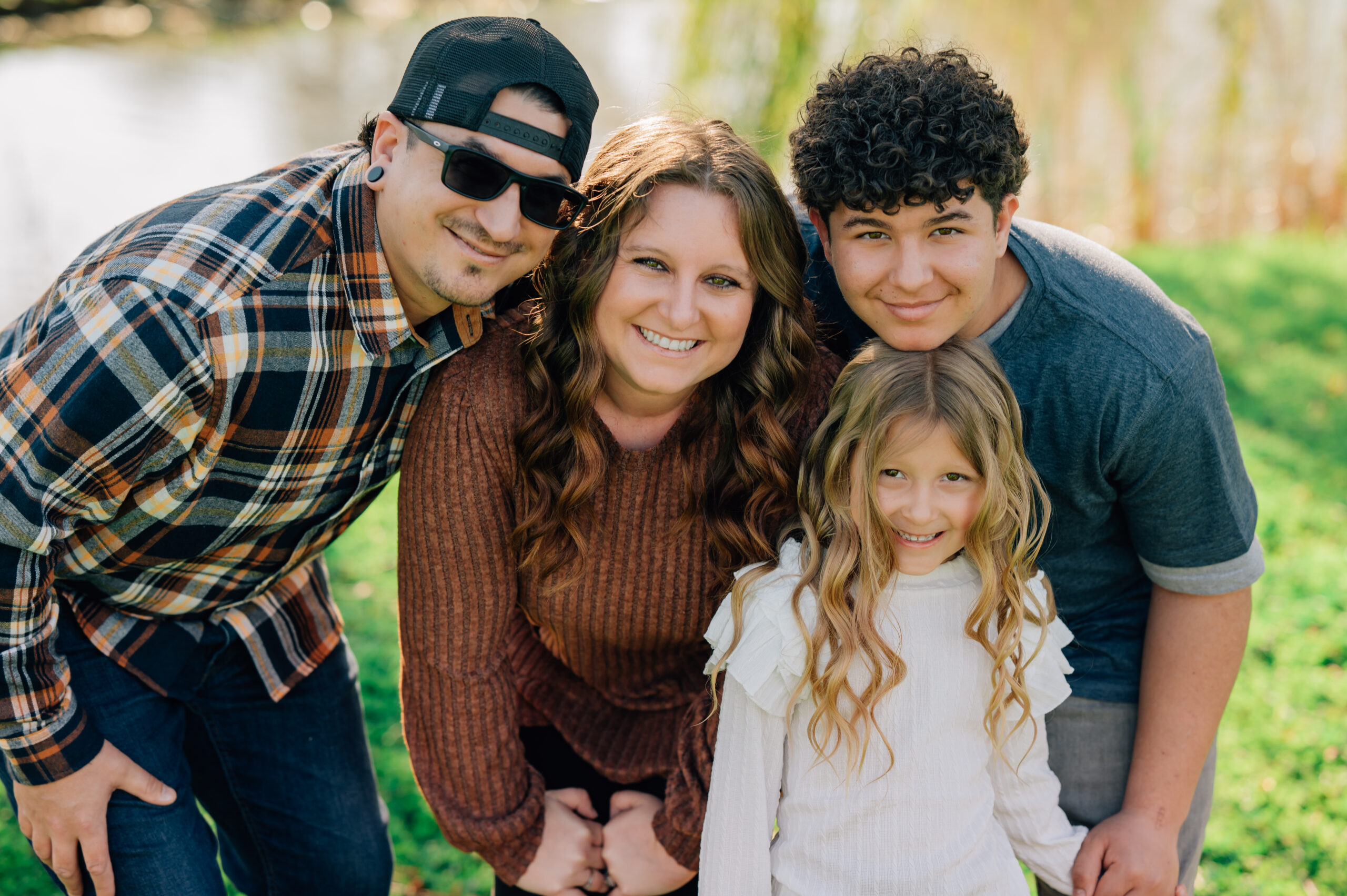 family portrait under willow tree at shumway oak grove park