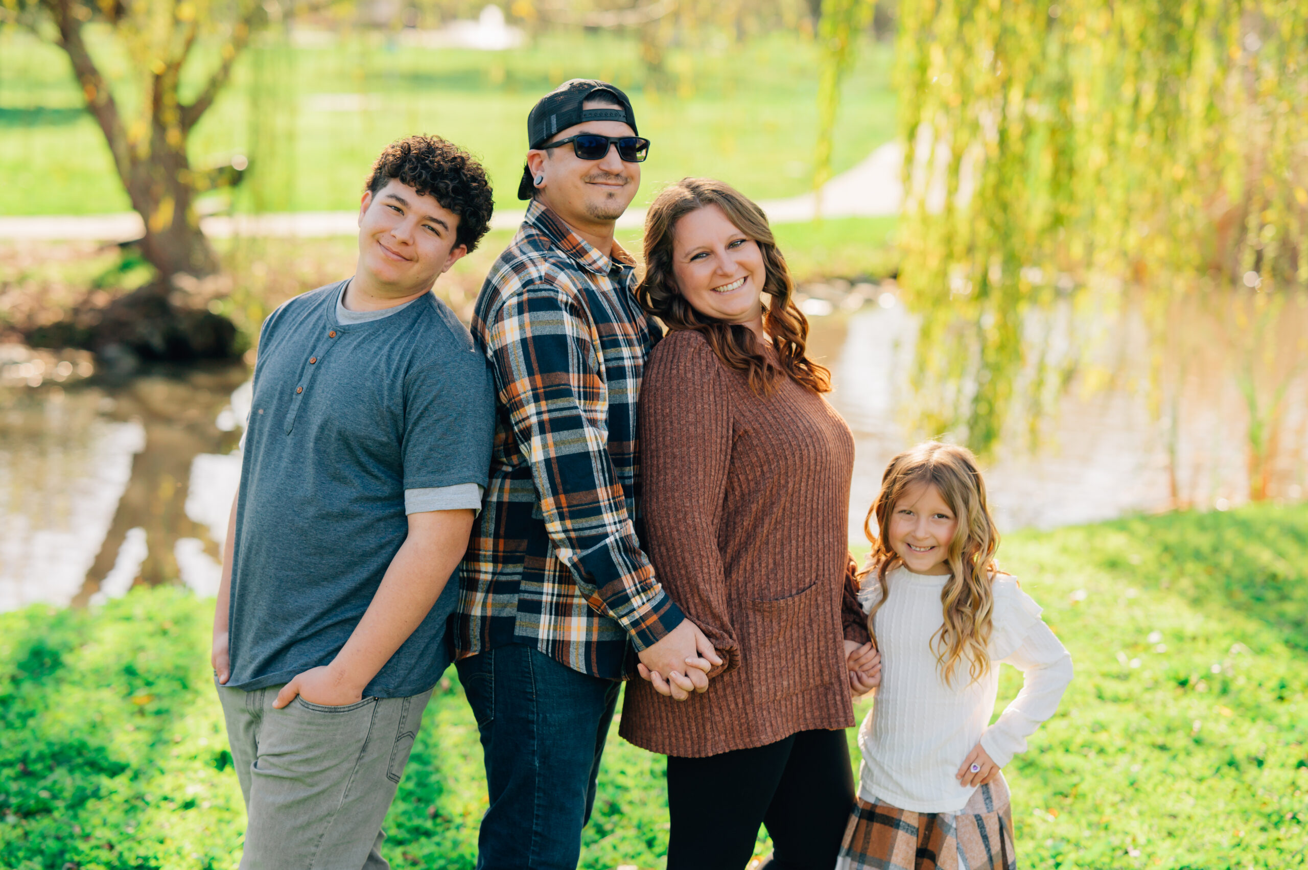 family portrait under willow tree at shumway oak grove park