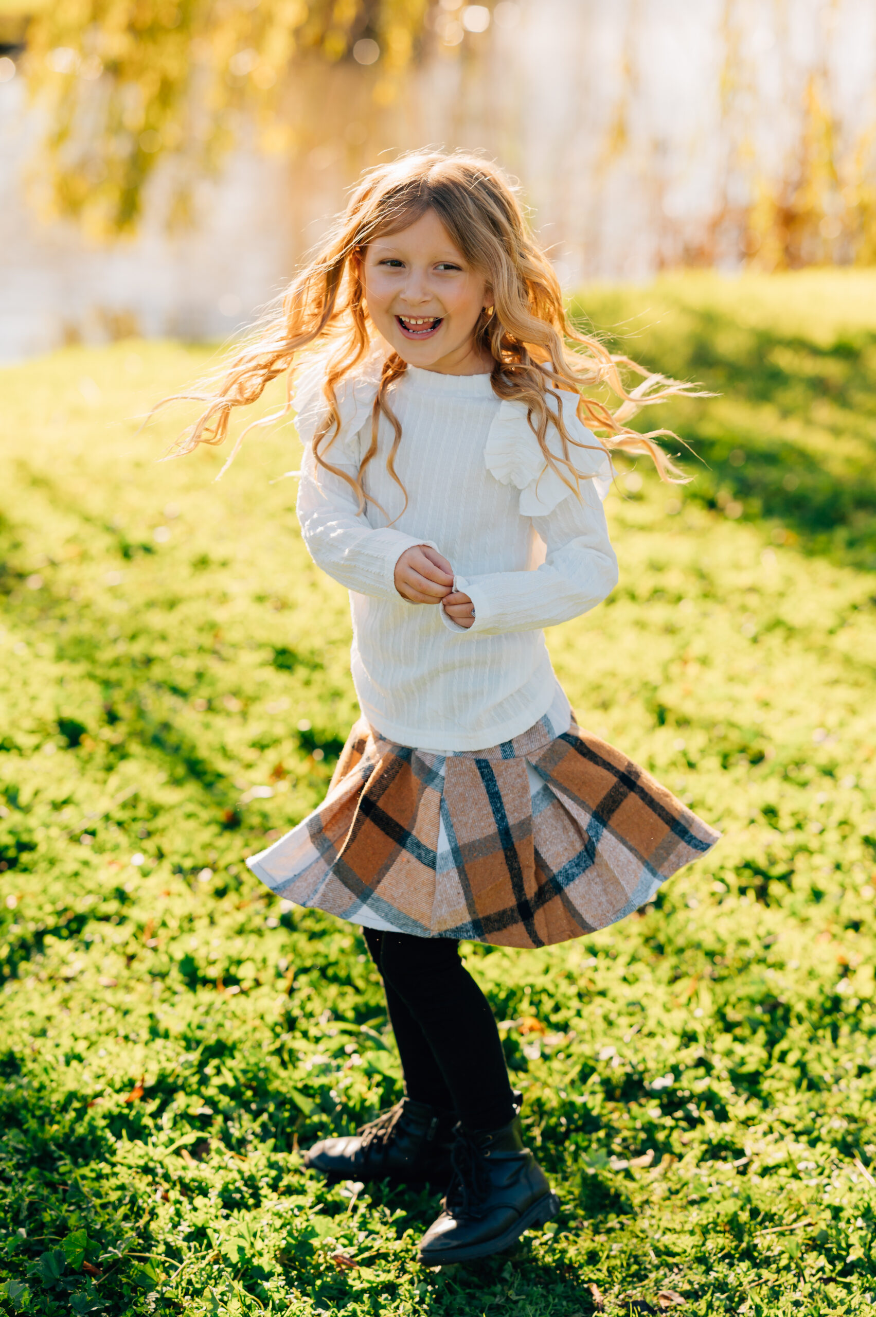young girl twirling dress during family photo session