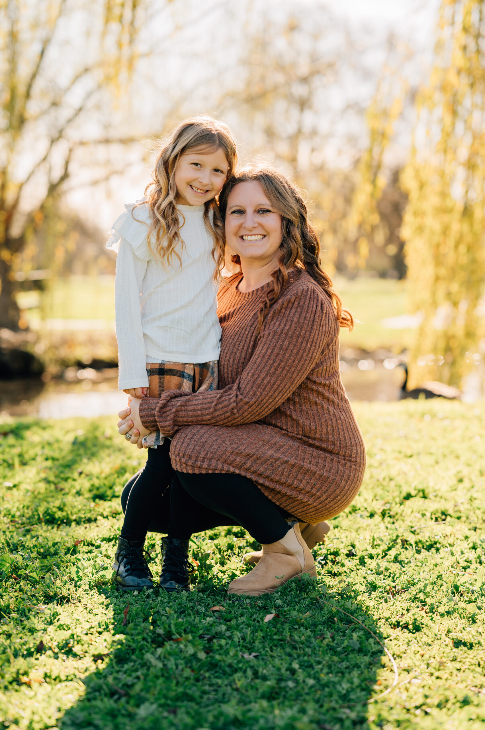 mother and daughter smiling during outdoor family session