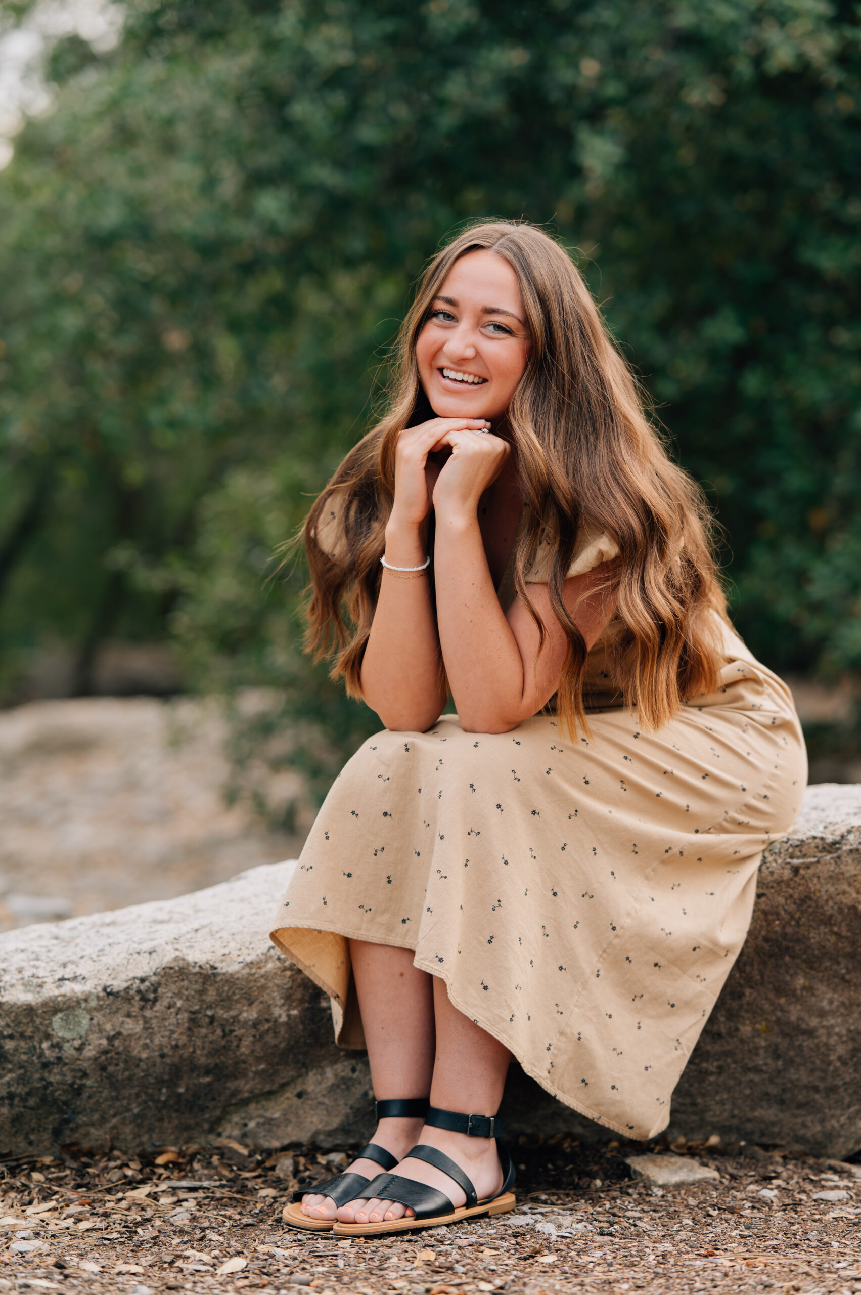 Natural senior portraits with relaxed posing and warm editing style