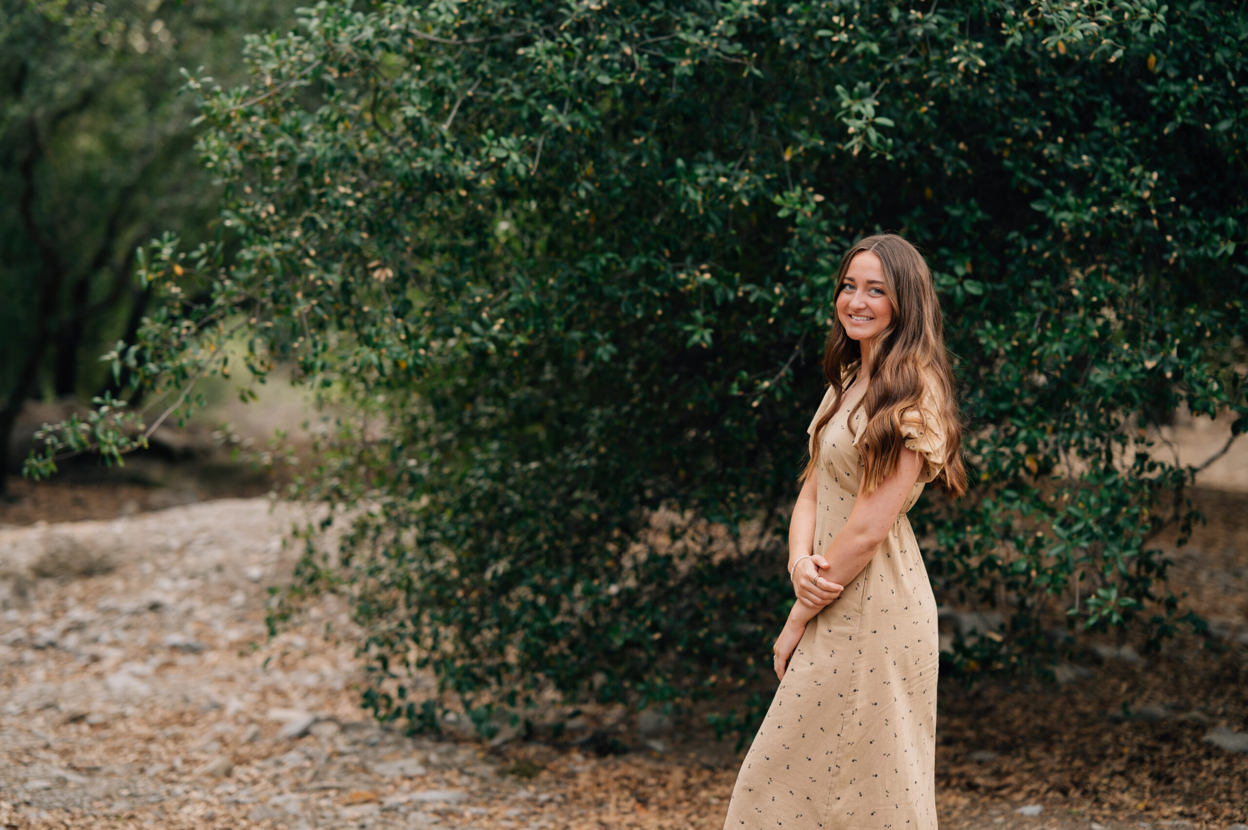 Relaxed senior session with neutral dress and golden earthy tones in California