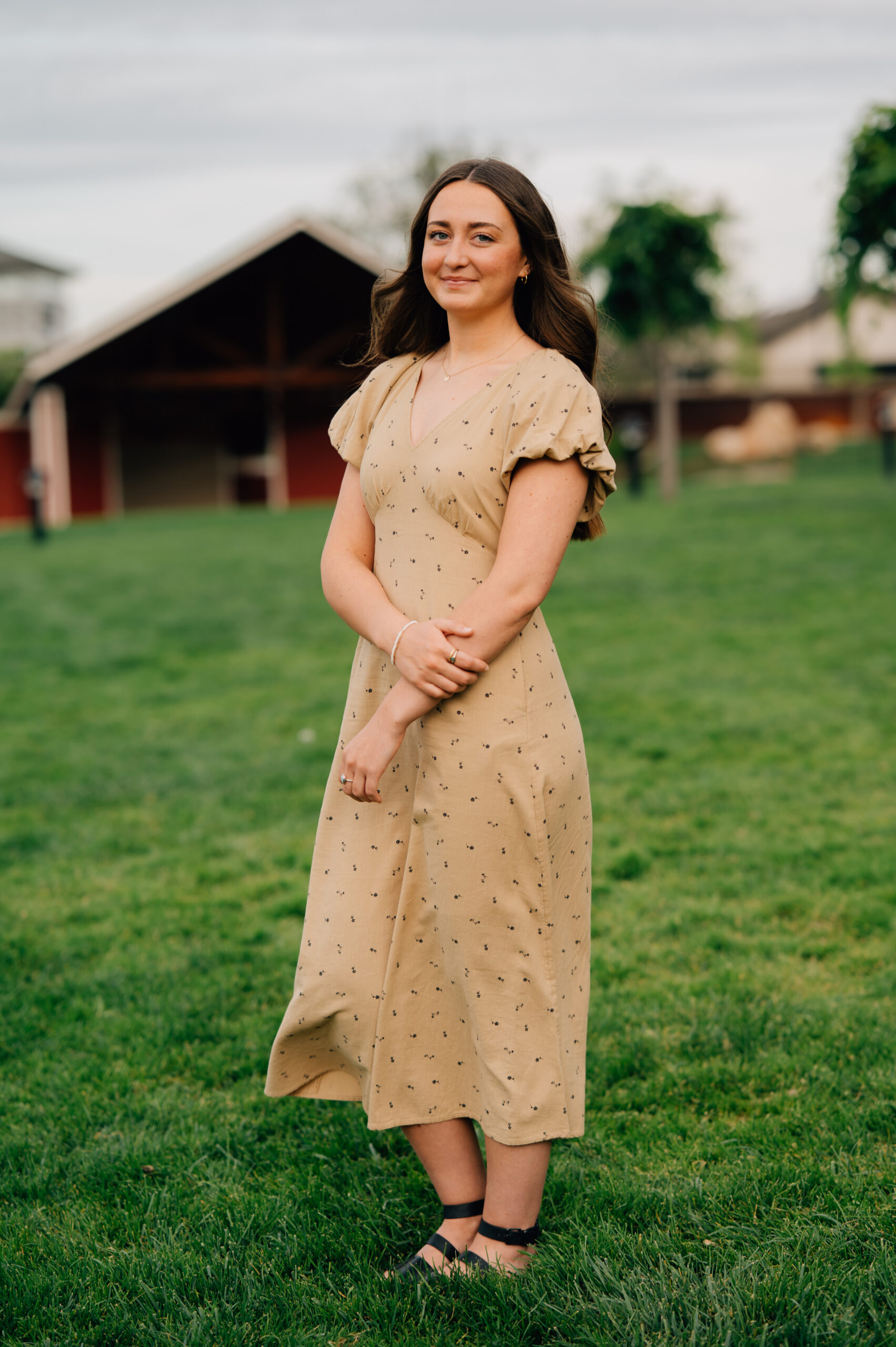 Senior portrait in grassy amphitheater area at Rocklin Quarry Park