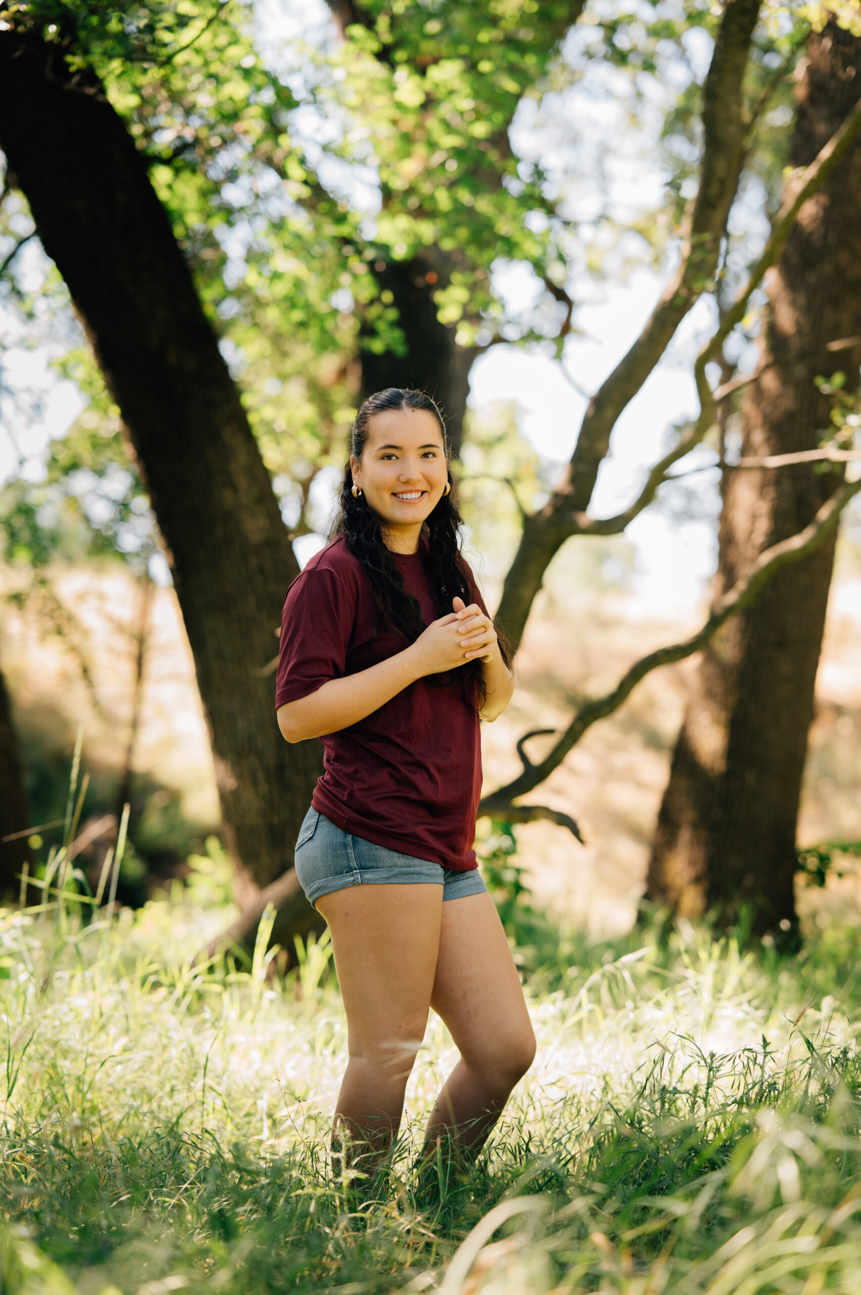 Senior portraits in wooded field at Johnson Springview Park