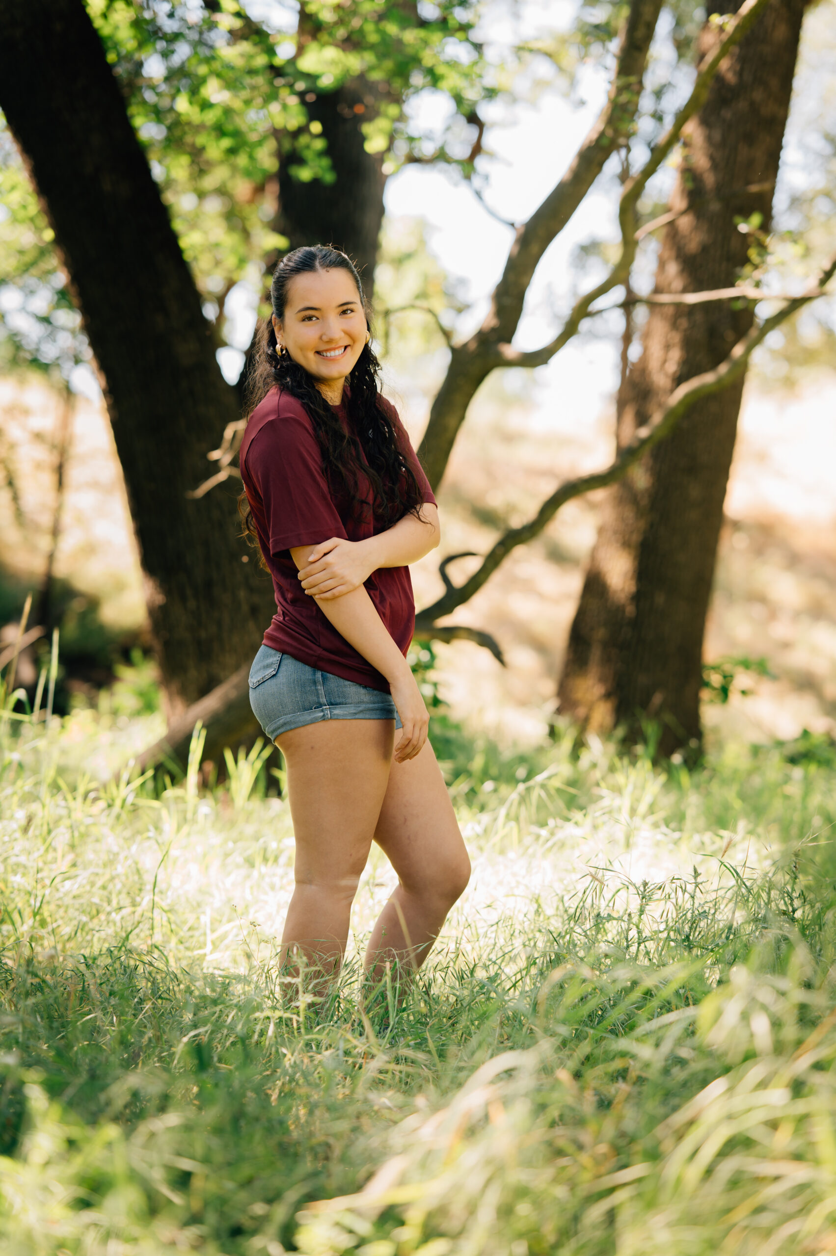 Senior portraits in wooded field at Johnson Springview Park