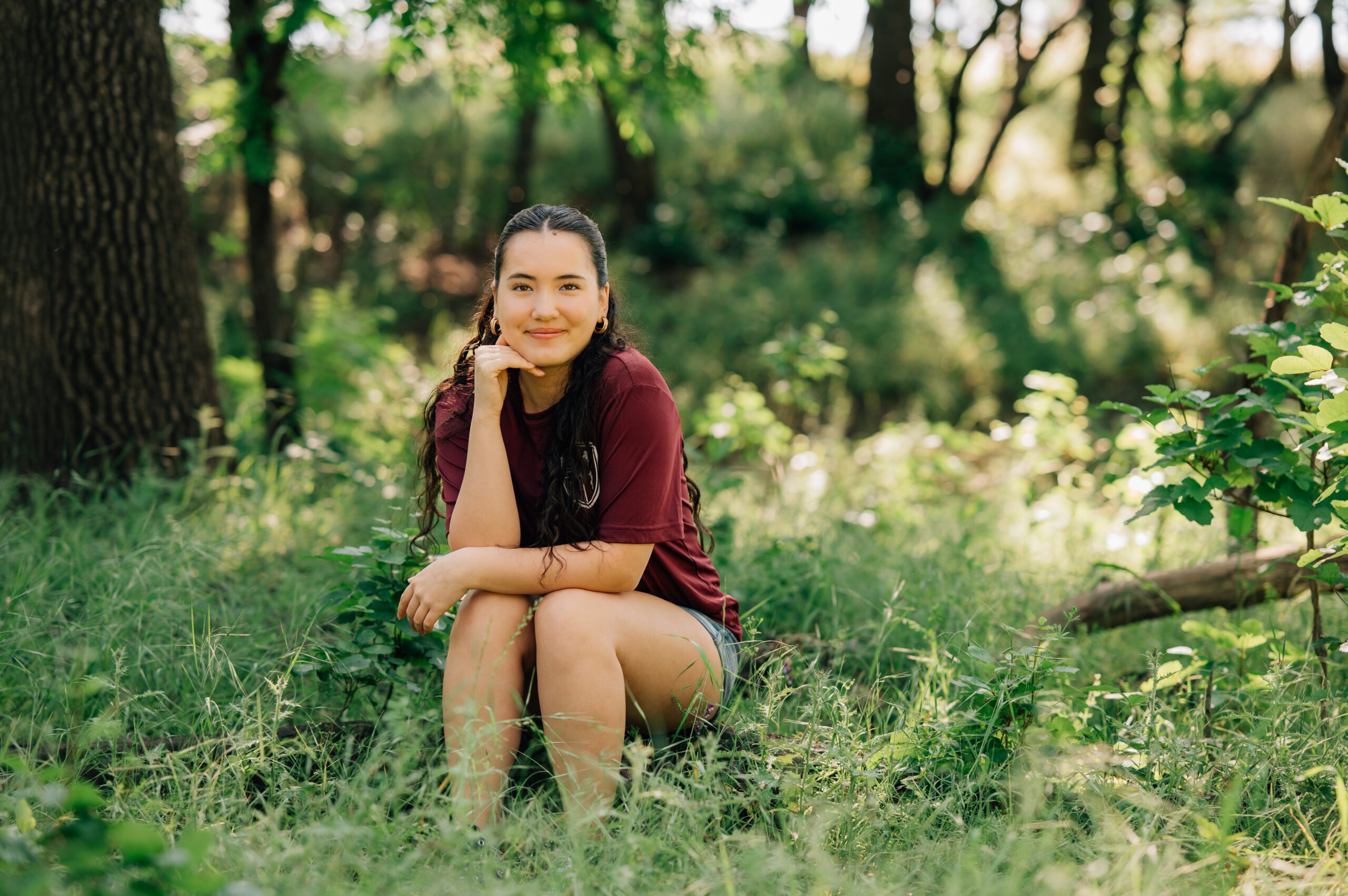 Senior portraits in wooded field at Johnson Springview Park
