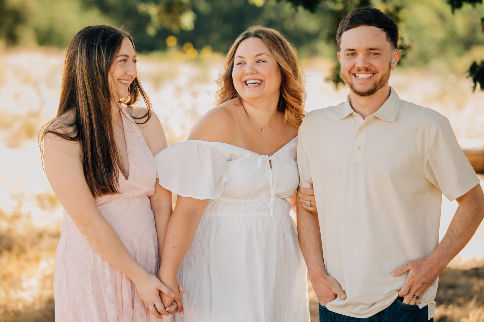 Siblings laughing at one another during an extended family session. 